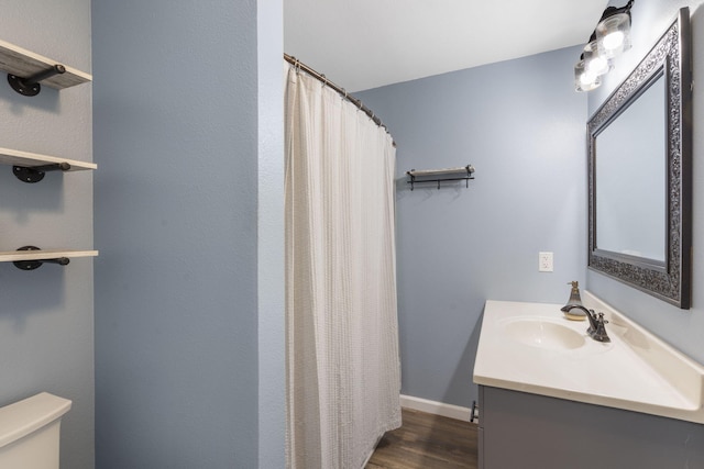 bathroom featuring vanity, a shower with curtain, wood-type flooring, and toilet