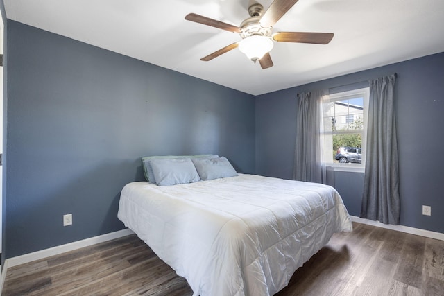 bedroom featuring dark wood-type flooring and ceiling fan