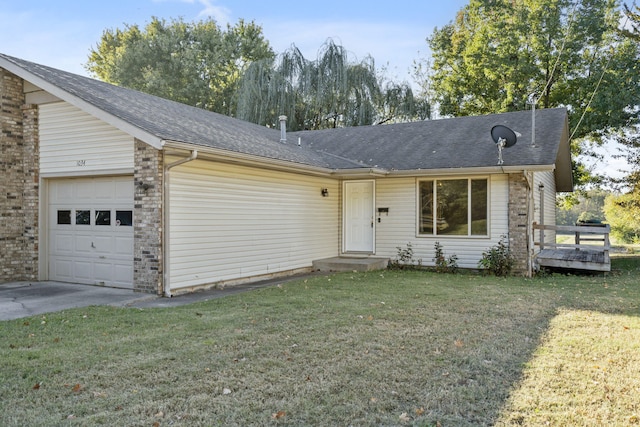 single story home featuring a front lawn and a garage