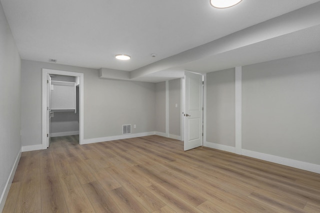 basement featuring light hardwood / wood-style flooring