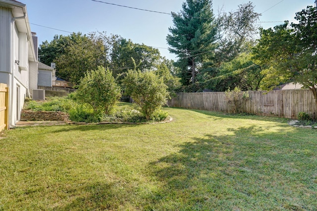 view of yard with central AC