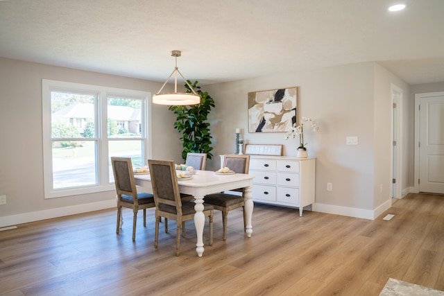 dining space featuring light hardwood / wood-style flooring