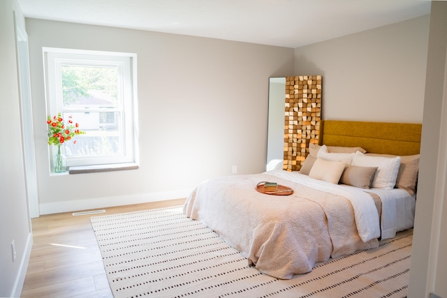 bedroom featuring light hardwood / wood-style floors