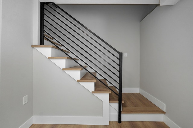 stairs with wood-type flooring