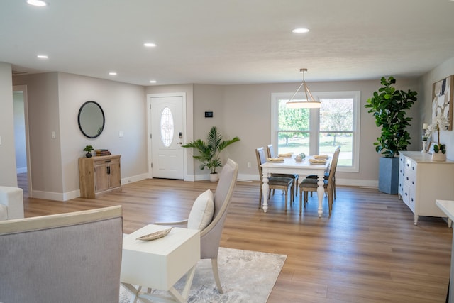 dining space with light wood-type flooring