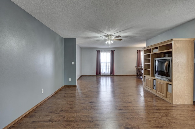 unfurnished living room with dark hardwood / wood-style floors, a textured ceiling, and ceiling fan