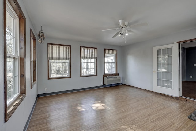 empty room featuring ceiling fan and light wood-type flooring