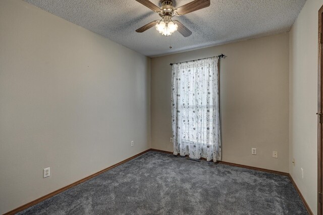 carpeted empty room featuring ceiling fan and a textured ceiling