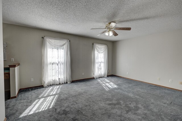 spare room featuring a textured ceiling and plenty of natural light