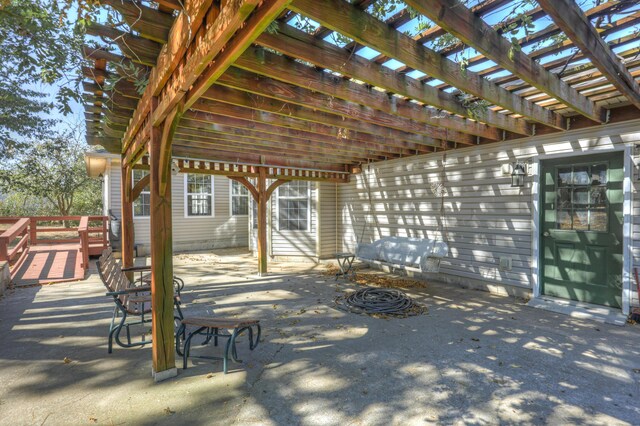 view of patio / terrace featuring a deck and a pergola