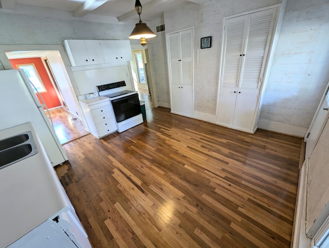 kitchen featuring white electric stove, dark hardwood / wood-style flooring, decorative light fixtures, white cabinets, and beam ceiling