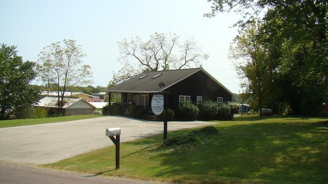 view of home's exterior with a lawn