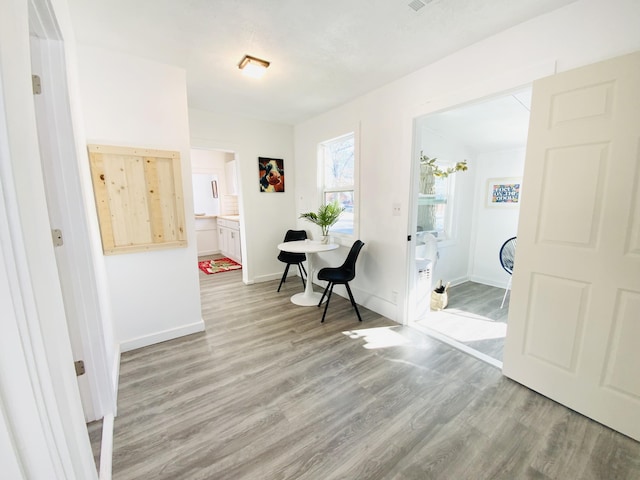 hall with light wood-type flooring