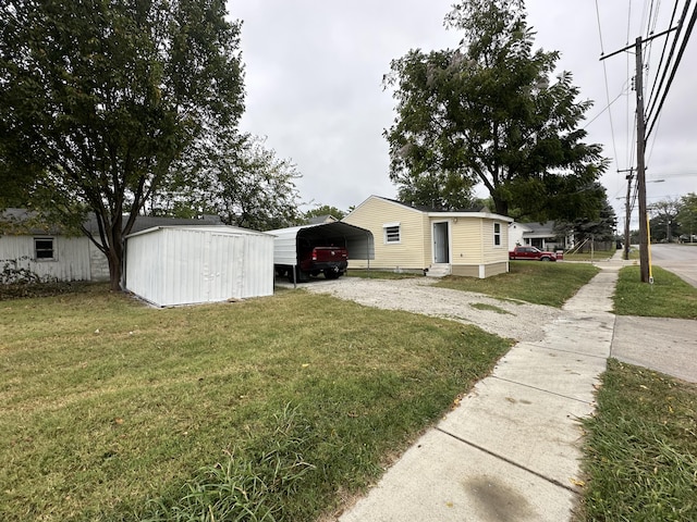 view of yard featuring a shed and a carport