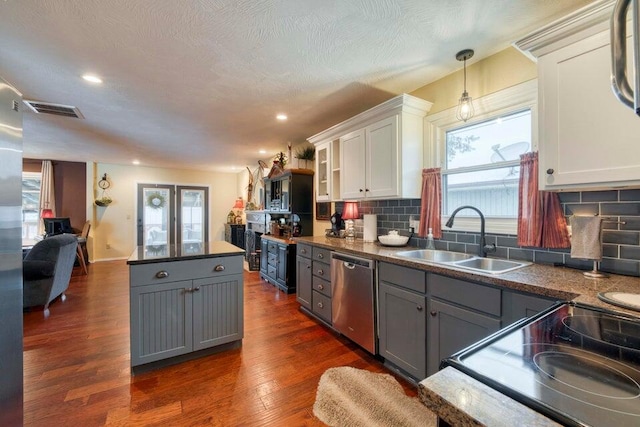 kitchen with dishwasher, dark wood-type flooring, gray cabinetry, sink, and white cabinets