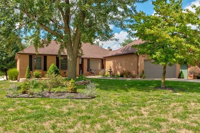 single story home featuring a front lawn and a garage