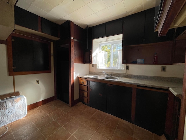 kitchen with sink and light tile patterned floors