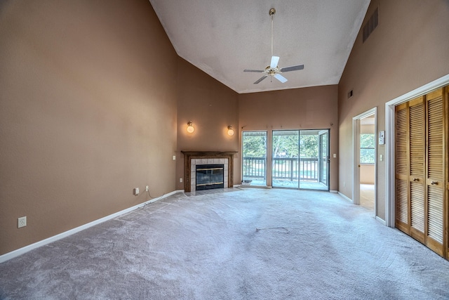 unfurnished living room with a fireplace, carpet floors, high vaulted ceiling, and ceiling fan