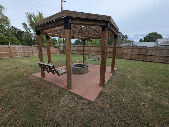 view of patio with a fire pit