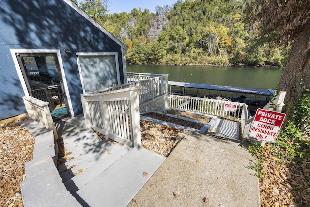 wooden terrace with a water view