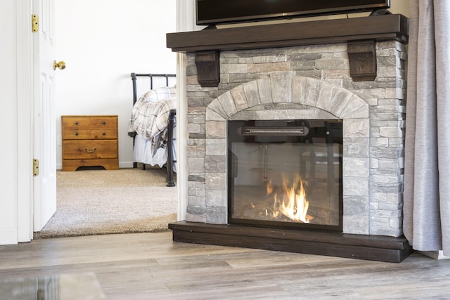 details with a fireplace and hardwood / wood-style flooring