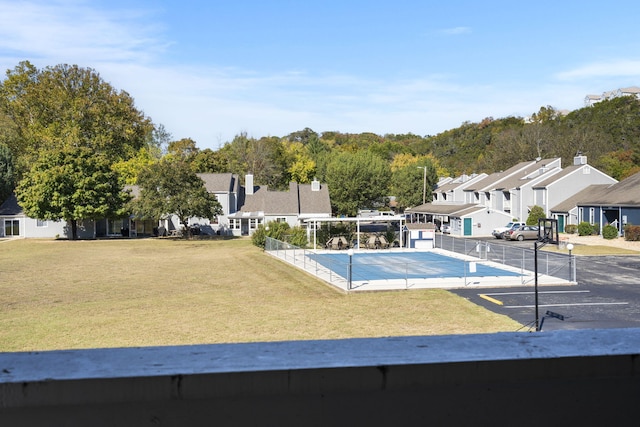 view of pool featuring a yard