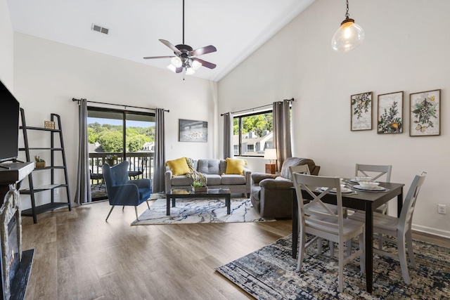 123 River Point Rd Unit 37, Hollister, MO 65672 - dining area featuring healthy amount of natural light, a ceiling fan, wood finished floors, and high vaulted ceiling