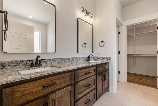 bathroom featuring vanity and wood-type flooring