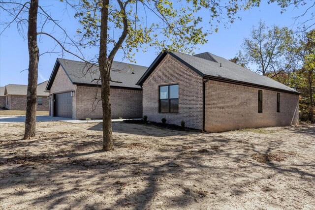 view of property exterior featuring a garage