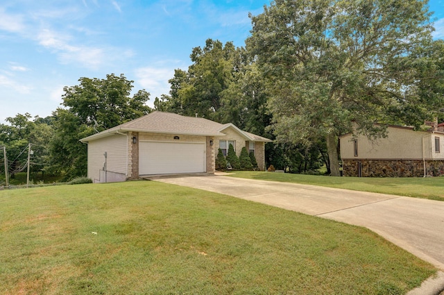 view of front of house with a front lawn and a garage