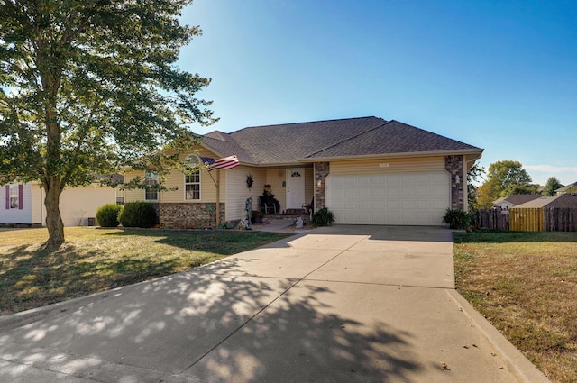 single story home featuring a front lawn and a garage