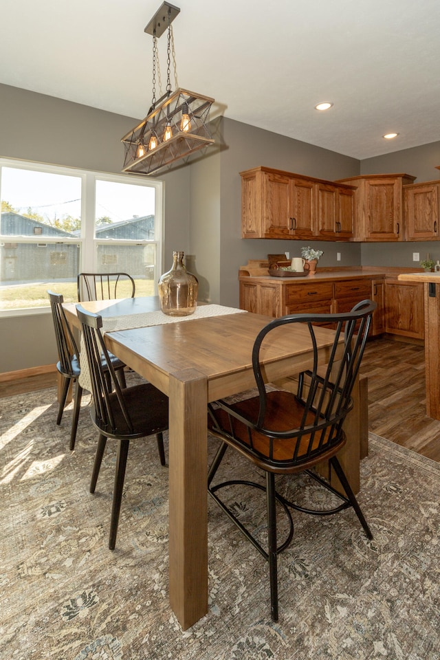 dining space with dark wood-type flooring