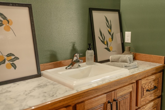 322 W Jefferson St, Bolivar, MO 65613 - bathroom featuring vanity and a textured wall