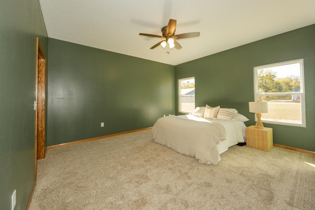 322 W Jefferson St, Bolivar, MO 65613 - bedroom with carpet floors, multiple windows, and baseboards
