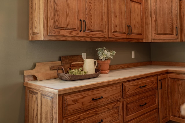 322 W Jefferson St, Bolivar, MO 65613 - kitchen with brown cabinetry