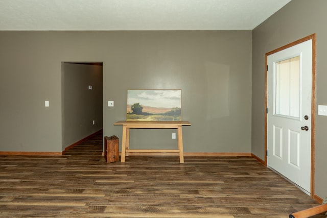 entryway with dark wood-type flooring