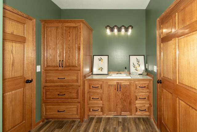 bathroom featuring vanity and hardwood / wood-style floors