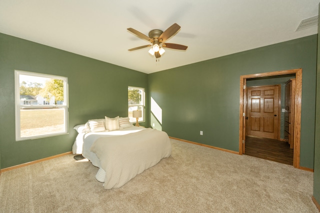 carpeted bedroom featuring ceiling fan