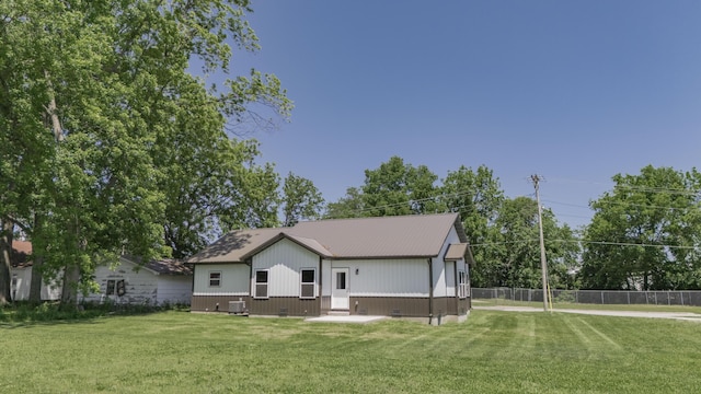 322 W Jefferson St, Bolivar, MO 65613 - rear view of property featuring central AC unit and metal roof