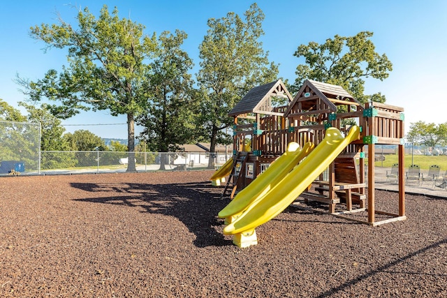 communal playground featuring fence