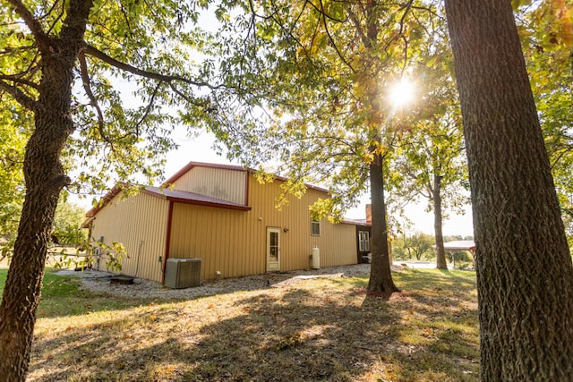 view of side of home featuring central air condition unit