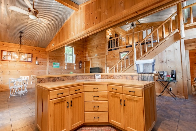 kitchen featuring lofted ceiling with beams, wooden walls, and tile patterned flooring