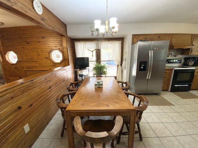 1814 State Highway 125, Sparta, MO 65753 - dining space with light tile patterned floors, wood walls, and a chandelier