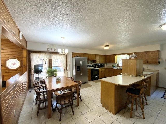 1814 State Highway 125, Sparta, MO 65753 - kitchen with brown cabinets, stainless steel refrigerator with ice dispenser, a textured ceiling, and electric stove
