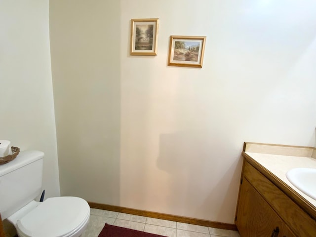 bathroom featuring vanity, toilet, and tile patterned flooring