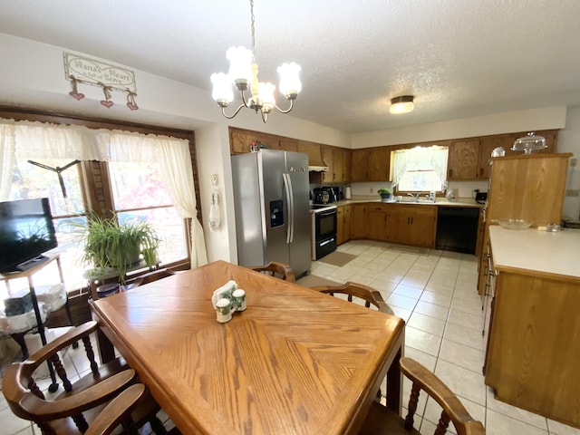 1814 State Highway 125, Sparta, MO 65753 - dining room featuring a textured ceiling, a notable chandelier, and light tile patterned flooring