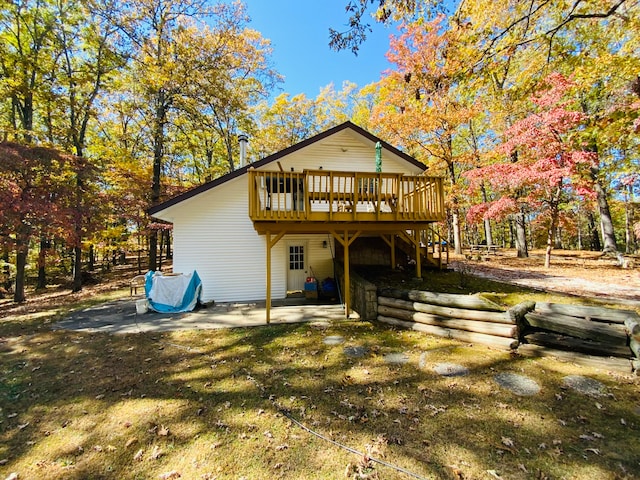 view of front facade with a patio and a deck