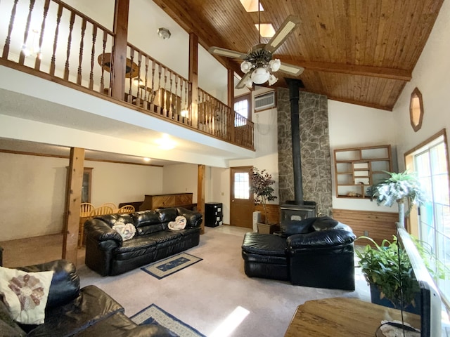 1814 State Highway 125, Sparta, MO 65753 - living area with a wood stove, ceiling fan, high vaulted ceiling, wooden ceiling, and carpet flooring