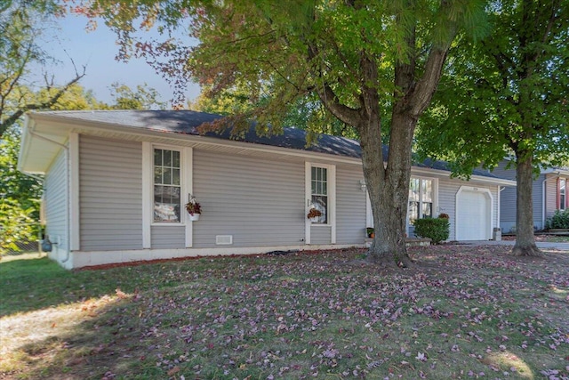 ranch-style house featuring a garage