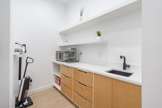 kitchen featuring sink and light hardwood / wood-style floors